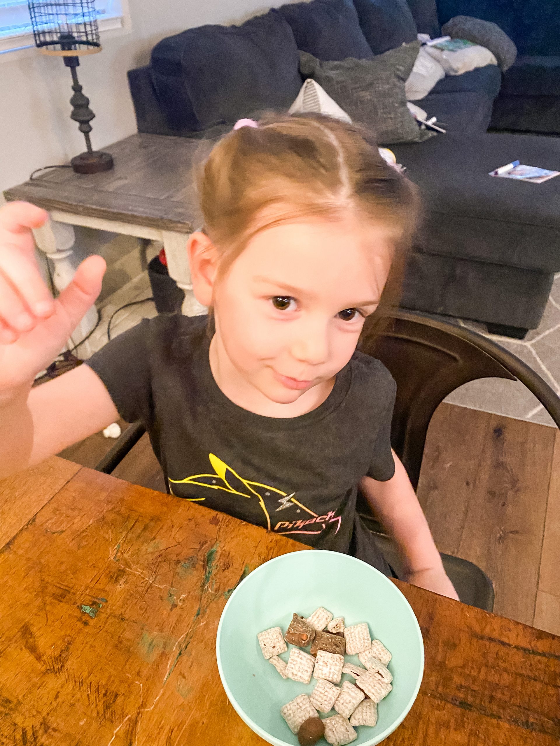 Four year old eating snack at table