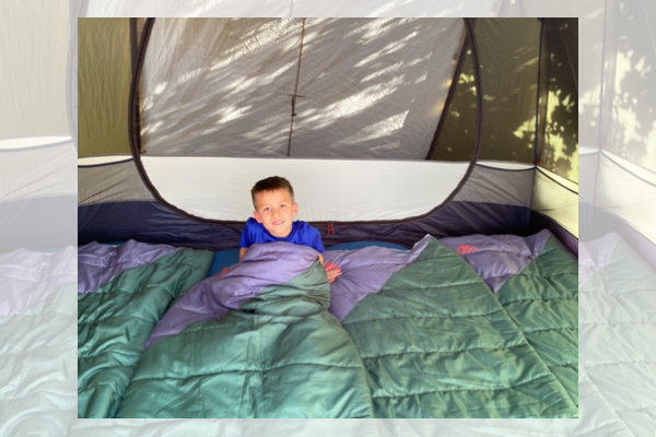Boy in Tent and Sleeping Bag