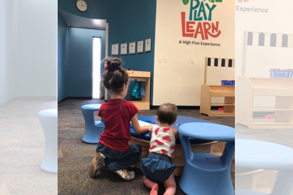 Girls learning and playing in early education